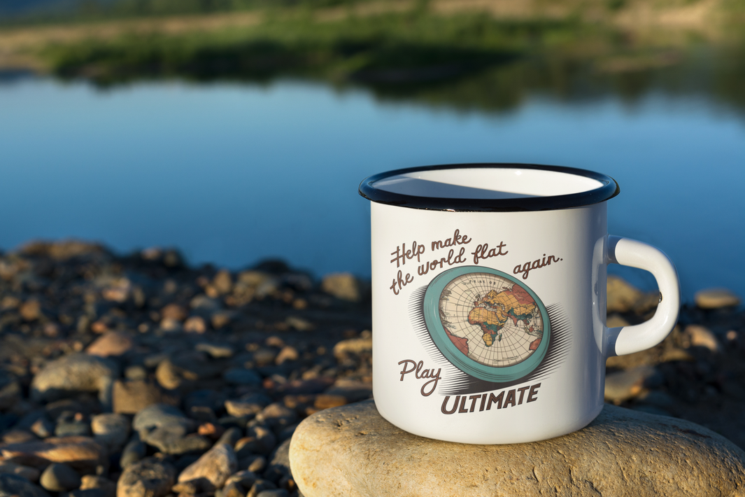 a white campers mug on the river's shore with the words Help Make The World Flat Again favorite frisbee gift
