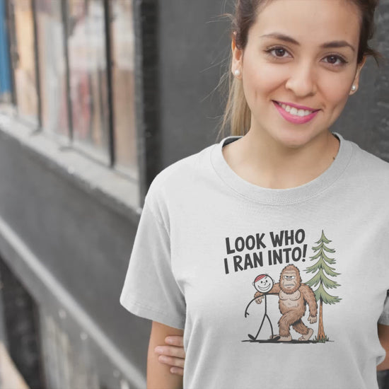 a video of young pretty woman wearing a Funny Look Who I Ran Into Bigfoot T-Shirt